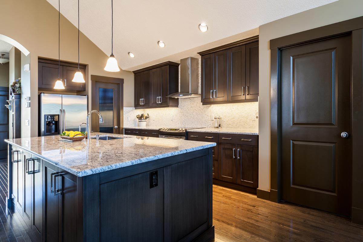 Discovery Ridge espresso kitchen with granite island