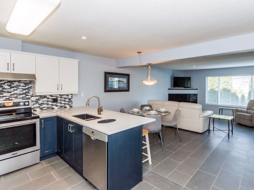 Riverside kitchen toward dining