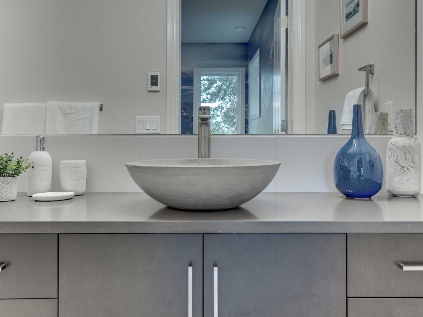 Valley Ridge grey bathroom with freestanding tub and vessel sink