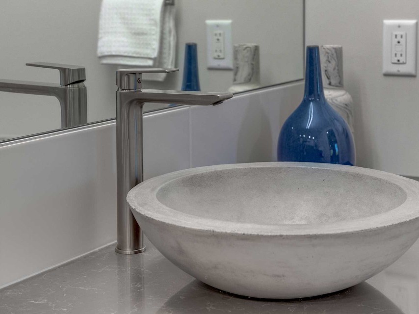Grey vanity and round mirror