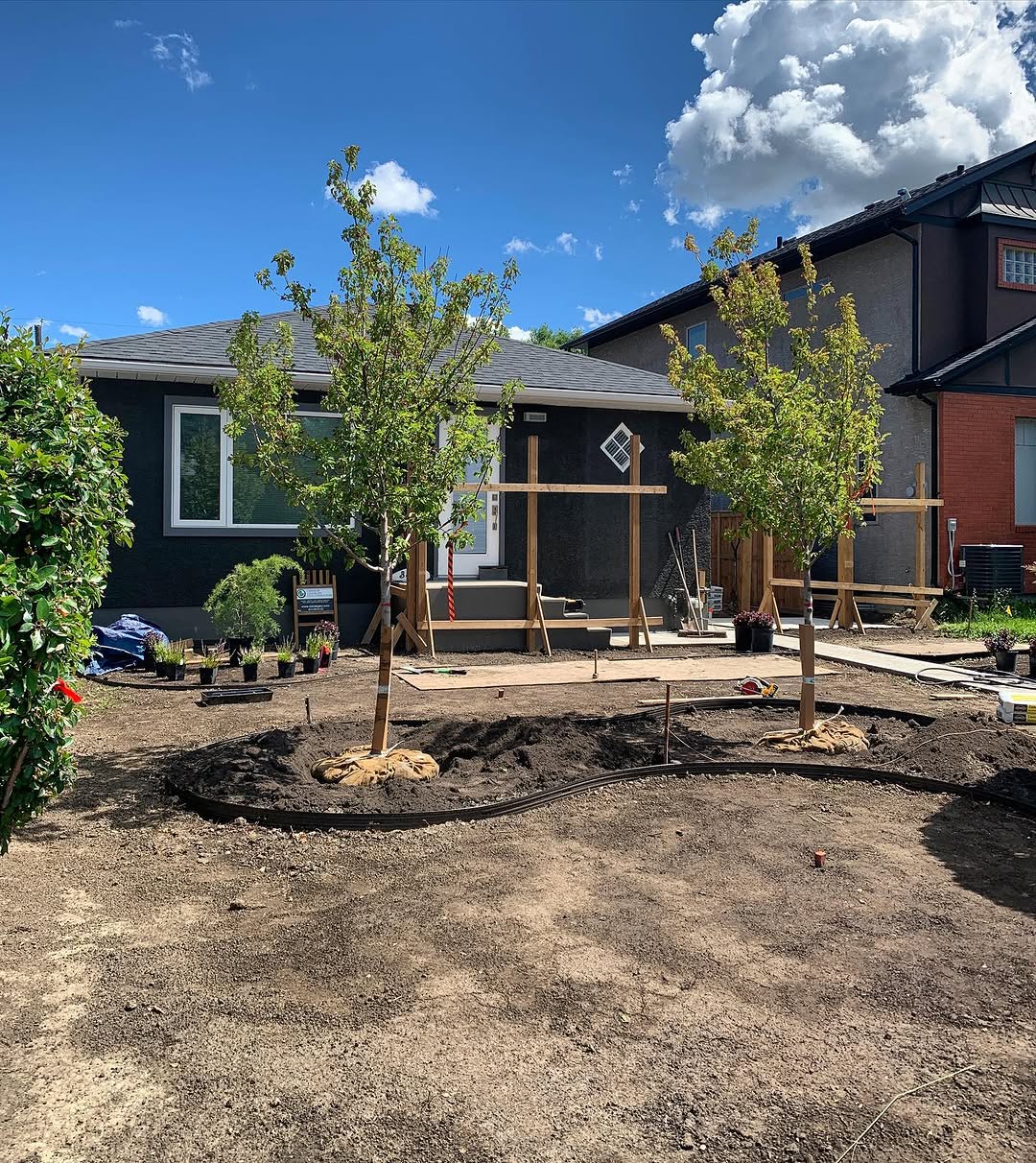 Backyard landscaping with garden beds in Calgary