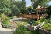 a garden with a gazebo in the middle of it