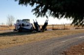 a tractor is parked on the side of the road